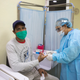 A man gets a COVID-19 rapid test at a field hospital in La Vega, Dominican Republic, which has seen over 15,000 confirmed cases.